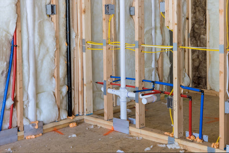 plastic PEX pipes and fittings on a water line